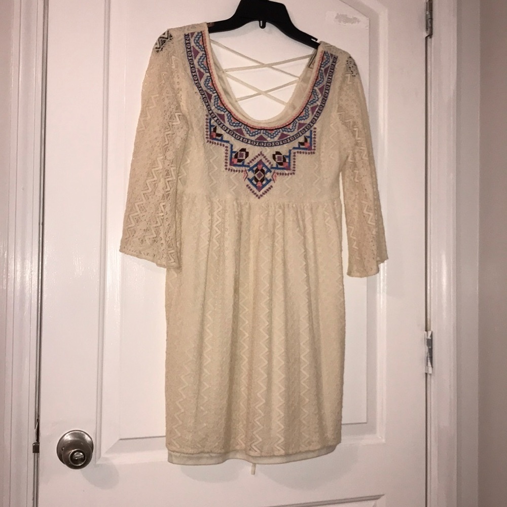 A beautiful ivory dress with cute designs at front